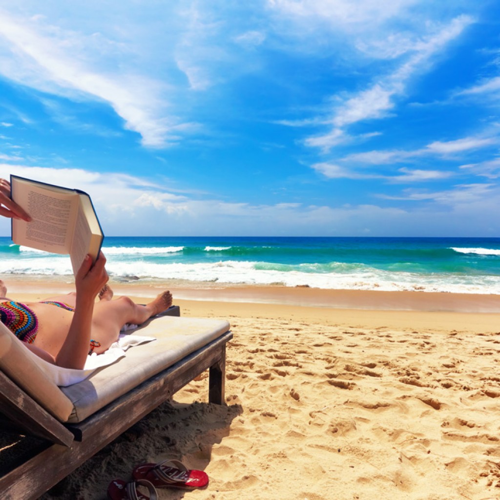 reading a book on Khao Lak Beach